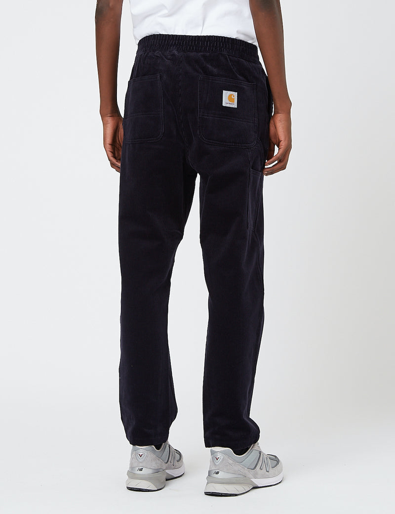Pantalon Flint Carhartt-WIP (velours côtelé extensible, 10,9 oz) - Dark Navy rinsed