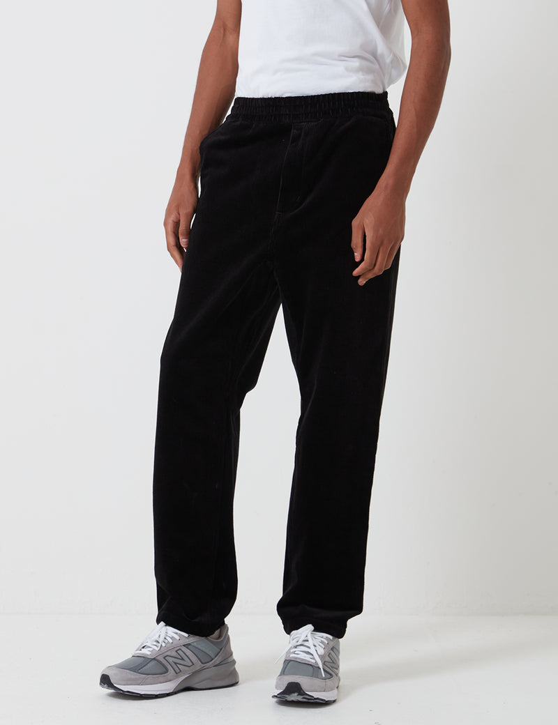 Pantalon Flint Carhartt-WIP (velours côtelé extensible, 10,9 oz) - Noir rincé