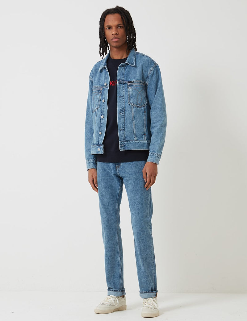 Calvin Klein Oversized Iconic Omega Trucker Mid Stone URBAN EXCESS